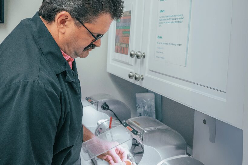 Dr. Anthony Lordo preparing dental implant instruments